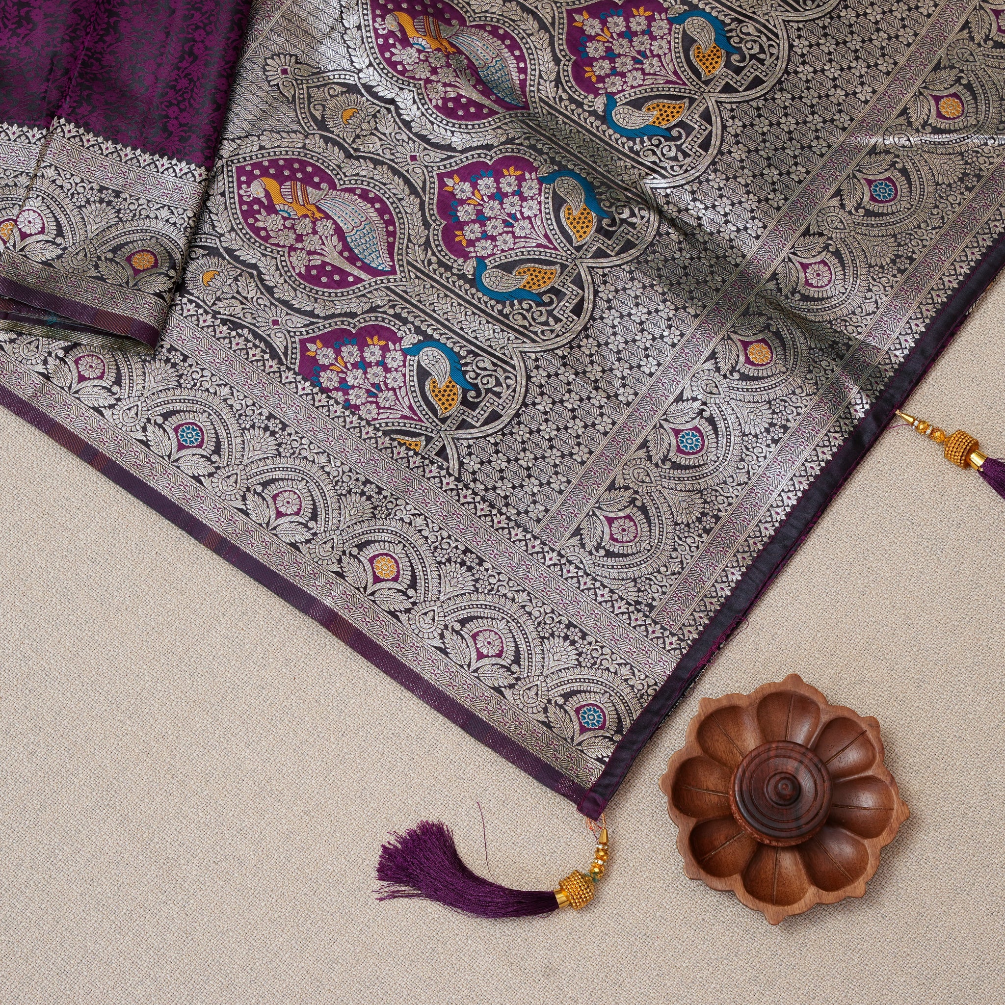 Luxurious Deep Purple Silk Saree with Intricate Silver Threadwork and Peacock Motifs